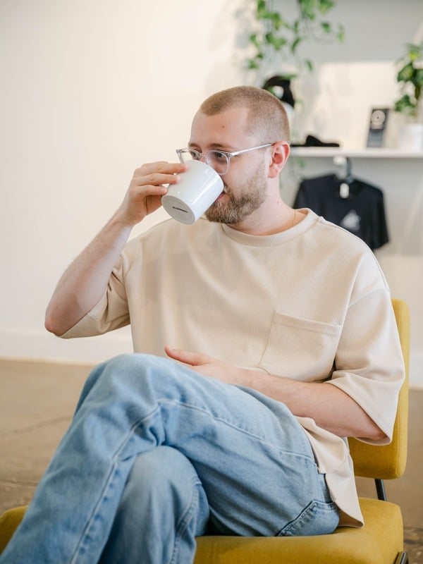 Guest enjoying a specialty coffee at Coalescence Coffee café in Norfolk VA