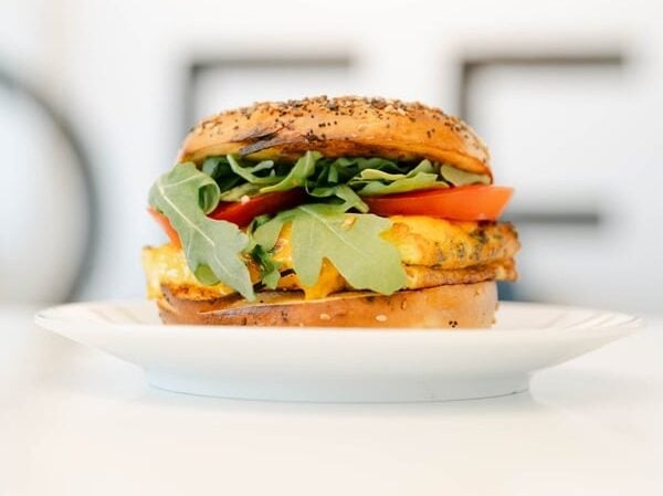 Turkey and cheese sandwich on white plate