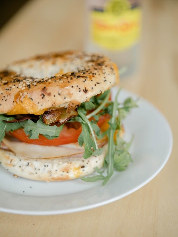 Bagel breakfast sandwich with egg and vegetables