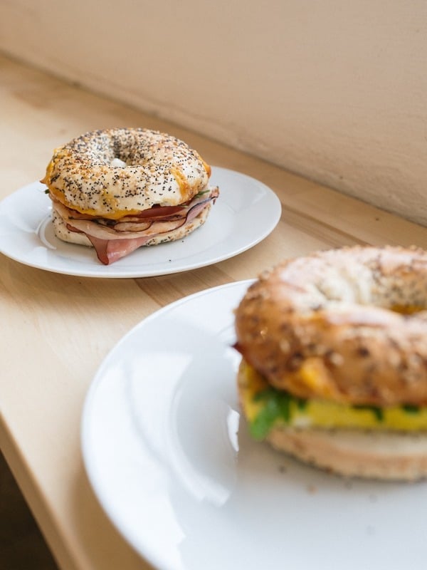 Bagel breakfast sandwich with egg and vegetables