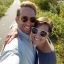 Couple taking a selfie outdoors on a sunny day